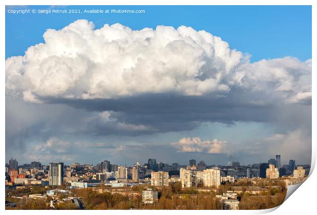 A large white-gray cloud hung over the city and was illuminated by the spring sunbeams. Print by Sergii Petruk