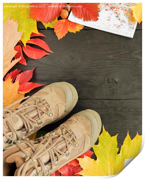 Autumn leaves, tracking boots and maps on a black background of an old tree Print by Sergii Petruk