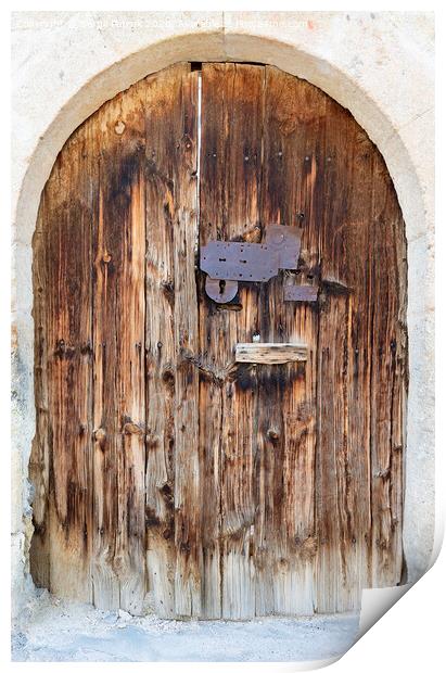 Ancient arched antique wooden doors with a metal lock in the middle Print by Sergii Petruk