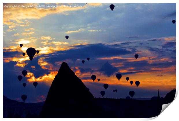 Attraction dozens of balloons climbed into the night sky above the conical peaks of the rocks in Cappadocia Print by Sergii Petruk