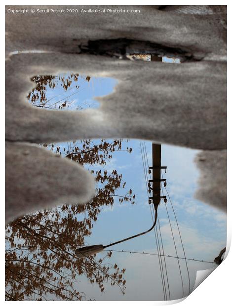 Reflection of the sky, the silhouette of a street lamp and a tree in a puddle on bad asphalt. Print by Sergii Petruk