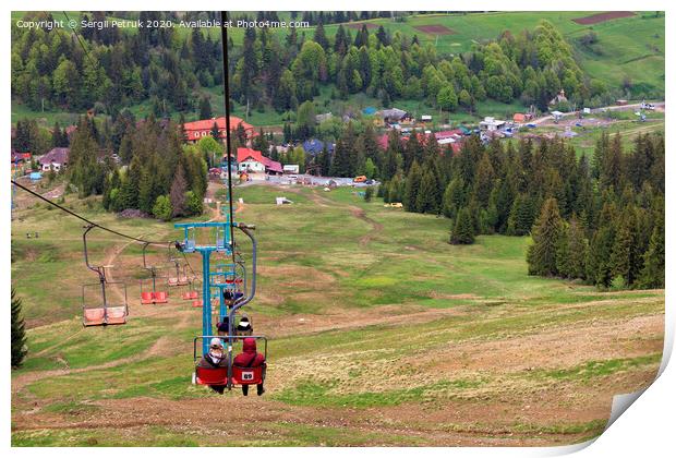 Mountain lift carries people into the valley to the village and the foot of the mountain. Print by Sergii Petruk