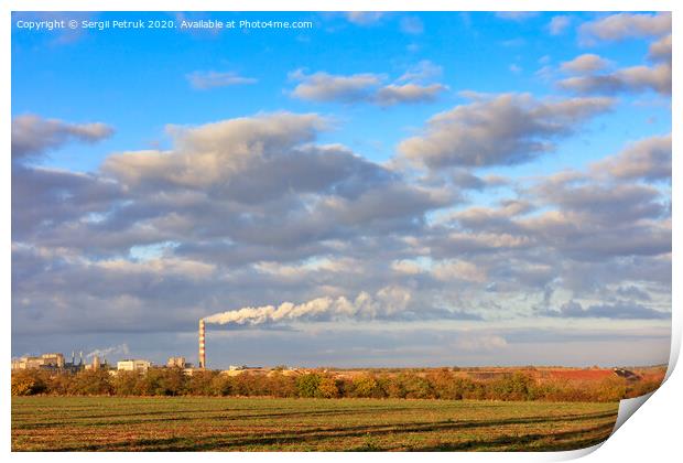 Rural autumn landscape, bright morning sunshine illuminate the agricultural field, the production complex on the horizon and a high cloudy sky. Print by Sergii Petruk