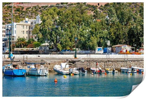 The picturesque promenade of Loutraki Bay, Greece, where old fishing schooners, boats and boats moor in the clear waters of the Ionian Sea. Print by Sergii Petruk