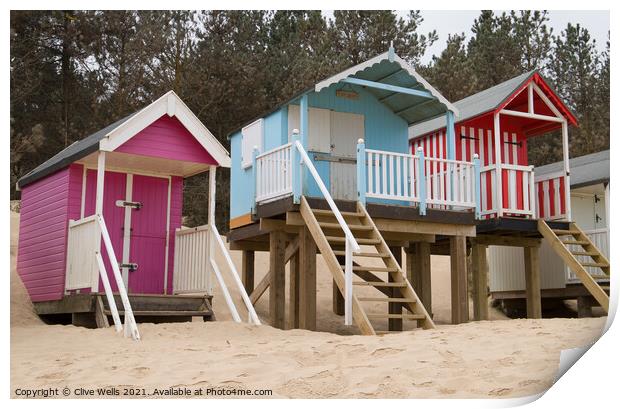 Pretty beach huts Print by Clive Wells