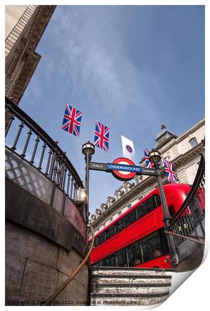 Bunting above the tube station with London bus. Print by Clive Wells