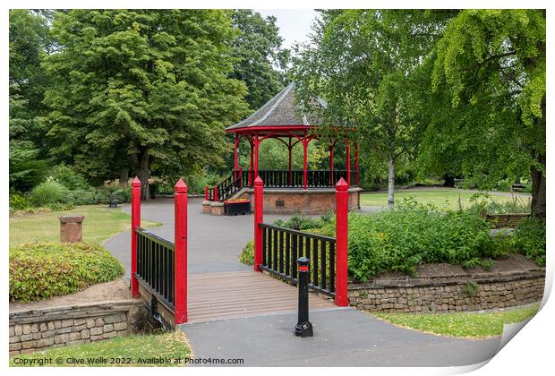 Footbridge to the Band stand Print by Clive Wells