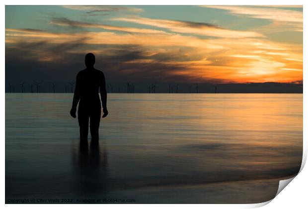 Iron man at sunset Print by Clive Wells