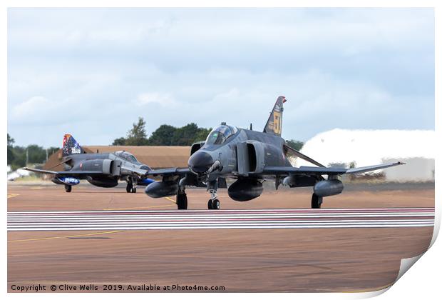 Both F-4E phantoms about to depart RAF Fairford Print by Clive Wells