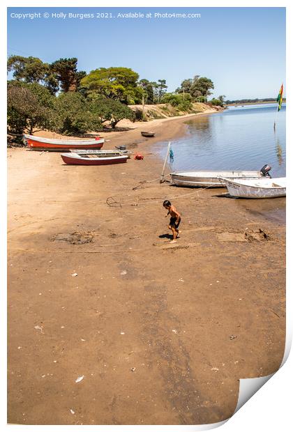 Punta De Este on the coast os South America, a boy playing on the beach  Print by Holly Burgess