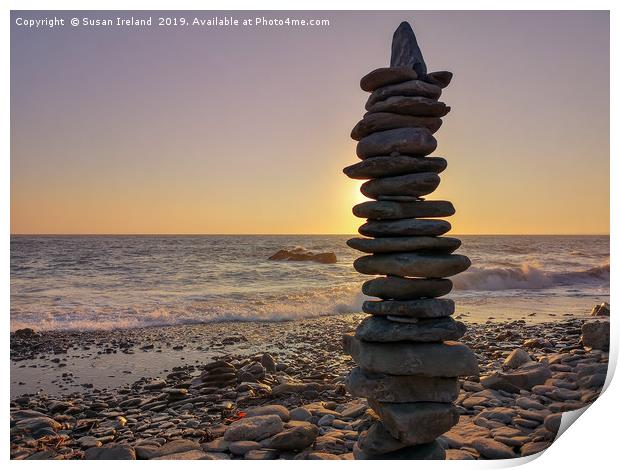 Stacked stones before a sunset  Print by Susan Ireland