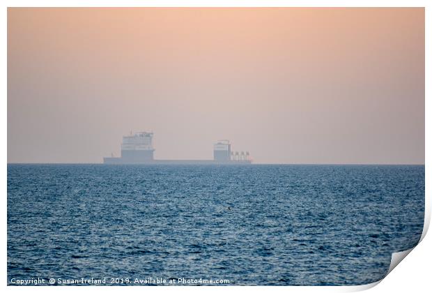 Boskalis ship in the horizon of a sunset Print by Susan Ireland