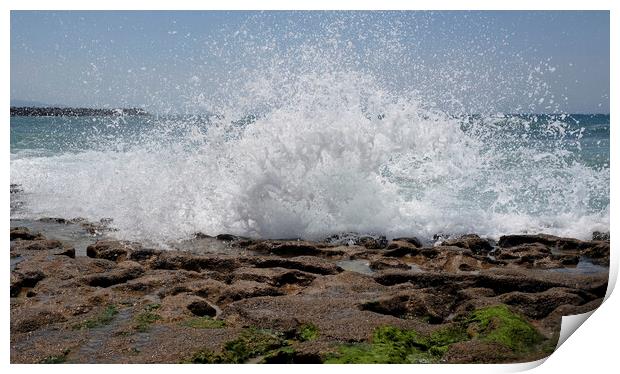 Waves arriving at the coast and splashing on the rocky shore Print by Lensw0rld 
