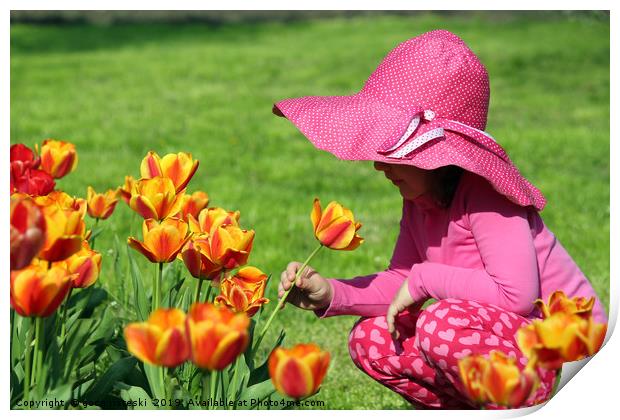 little girl smell tulip flower spring scene Print by goce risteski