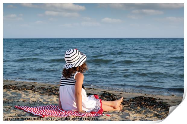 little girl sitting on beach Print by goce risteski