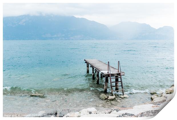 Quiet shore of Lake Garda on a rainy day near the empty jetty. Print by Joaquin Corbalan