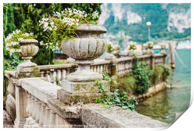 Elegant flower pots decorate the classic stone railing on a roma Print by Joaquin Corbalan
