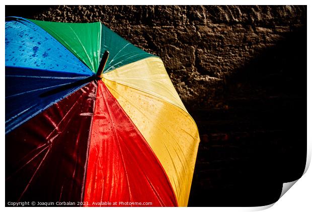 Open umbrella against the intense sun with bright colors and dar Print by Joaquin Corbalan
