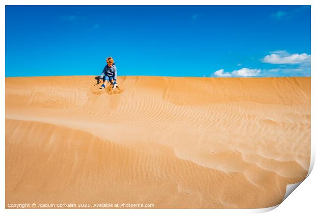 A child played on the sand dunes having fun with freedom, negati Print by Joaquin Corbalan