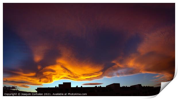 Beautiful sunset sky with red and orange clouds behind the city  Print by Joaquin Corbalan