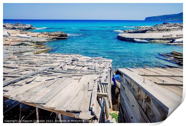 Traditional rustic pier with wooden boards in a cove in Formente Print by Joaquin Corbalan