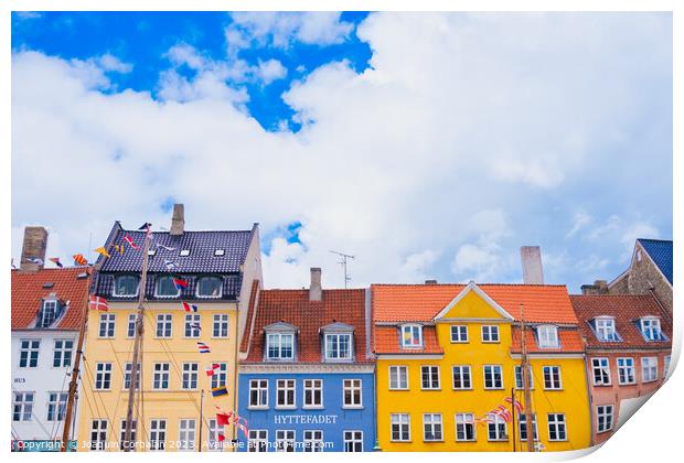 Copenhagen, Denmark - August 8, 2023: The most famous canal in Copenhagen with its quaint colorful houses overlooking the docked sailboats. Print by Joaquin Corbalan