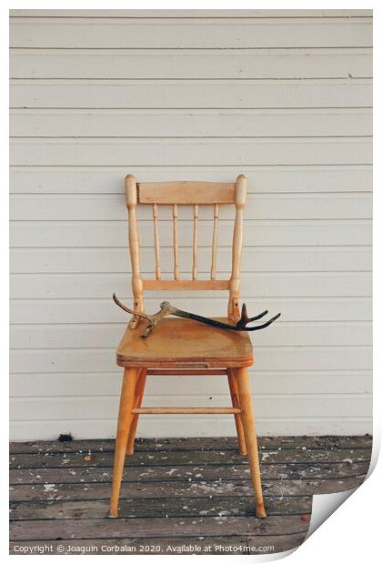 Old vintage wooden chair, with deer antlers Print by Joaquin Corbalan