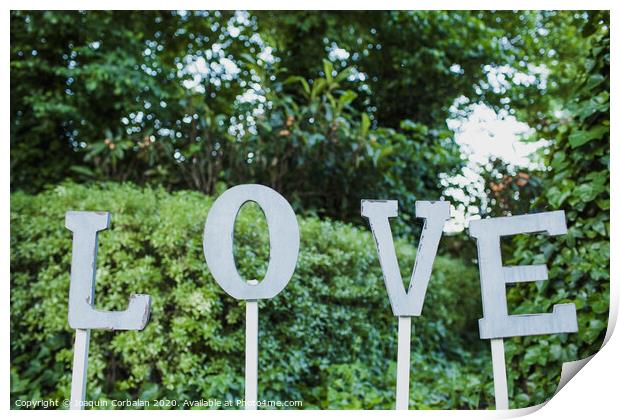 Word Love in wooden letters to decorate a wedding. Print by Joaquin Corbalan