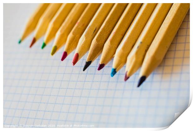 Group of pencils arranged on graph paper. Print by Joaquin Corbalan