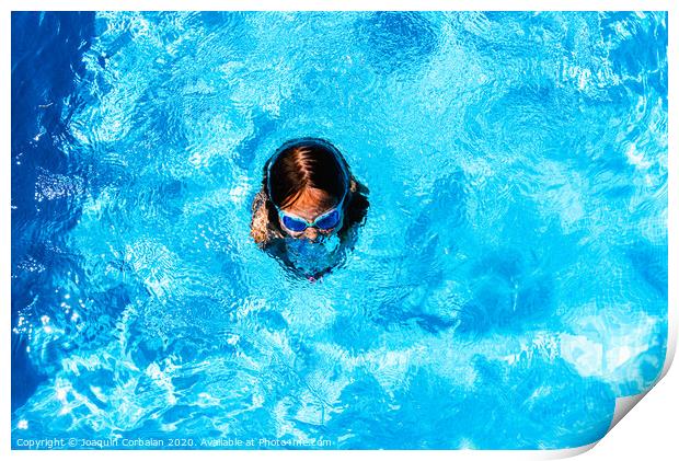 Little girl enjoying the good weather by bathing in her pool playing splashing. Print by Joaquin Corbalan