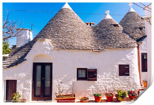 Houses of the tourist and famous Italian city of Alberobello, with its typical white walls and trulli conical roofs. Print by Joaquin Corbalan