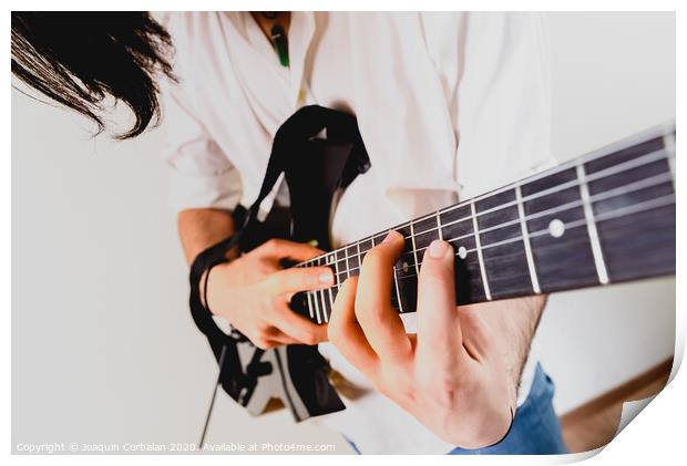 Close-up of the hands of a guitarist performing a song while pressing the strings. Print by Joaquin Corbalan