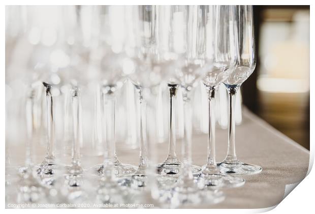 Group of empty and transparent champagne glasses in a restaurant.Group of empty and transparent champagne glasses in a restaurant. Print by Joaquin Corbalan