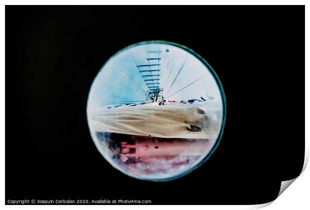 Ship moored to port seen through from inside the porthole of a ship. Print by Joaquin Corbalan