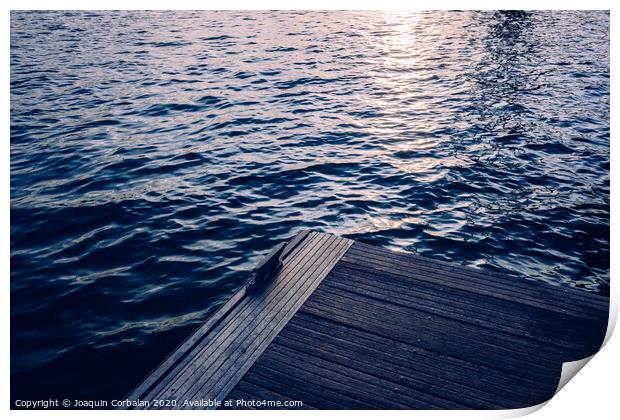 Sunset on a seawater jetty, with retro blue vintage tones, as a background for fashion. Print by Joaquin Corbalan