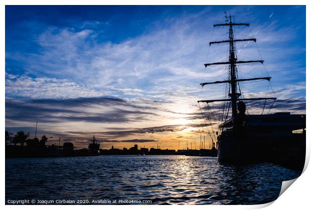 A classic sailboat moored to port in a beautiful sunset. Print by Joaquin Corbalan