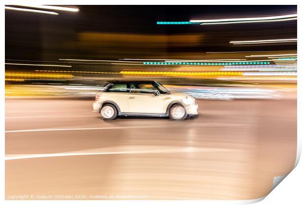 Car rolling at full speed through the city at night, image of panning, with defocused background lights. Print by Joaquin Corbalan