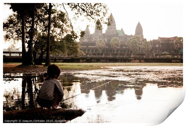 Girl fishing in the lake of Angkor Wat, ancient Cambodian city hidden in the forest very visited by tourists Print by Joaquin Corbalan