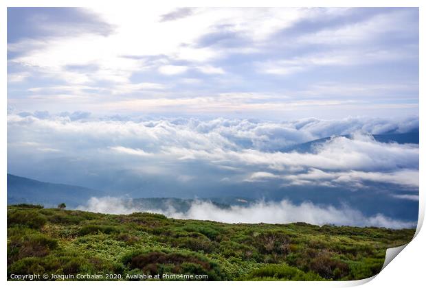 Scene of a winter cloudy sky from the top of a mountain peak. Print by Joaquin Corbalan