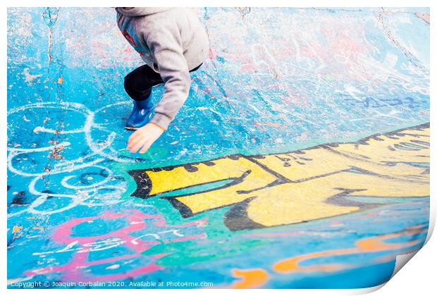 Boy running inside an urban skatepark with sweatshirt having fun, blue tones. Print by Joaquin Corbalan