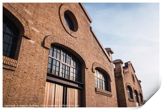 Facade of the old train workshop factories in the Central Park of Valencia. Print by Joaquin Corbalan