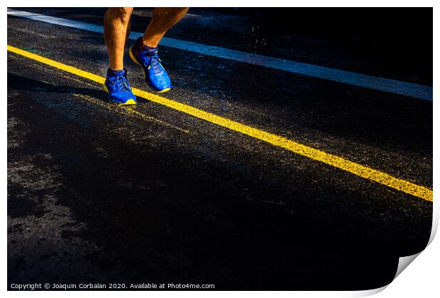 A lonely runner trains on wet asphalt at sunset, copy space. Print by Joaquin Corbalan