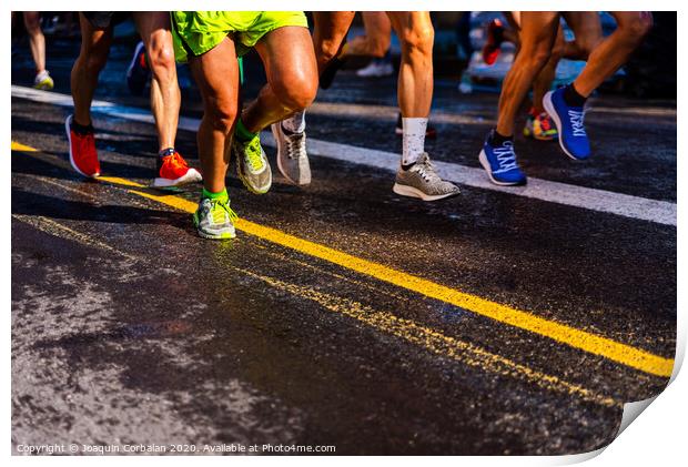 Muscled legs of a group of several runners training running on asphalt Print by Joaquin Corbalan