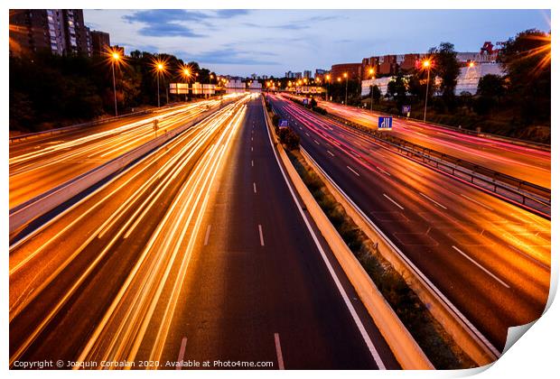 Trails of car lights on a large road at night. Print by Joaquin Corbalan
