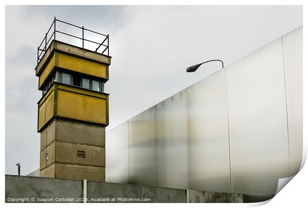 Berlin, Germany - June 6, 2019: Watchtower next to a wall on a border to control illegal immigrants. Print by Joaquin Corbalan