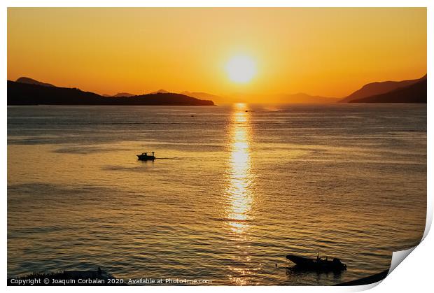 Sunset in a bay with mountains in the background and a small boat anchored. Print by Joaquin Corbalan