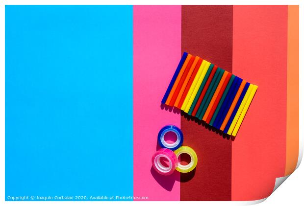 Colored background seen from above with plastic bars to use in crafts and stationery. Print by Joaquin Corbalan