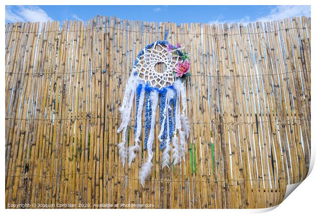 Vintage indigenous decoration hanging from a wall of old reeds, intense colors. Print by Joaquin Corbalan