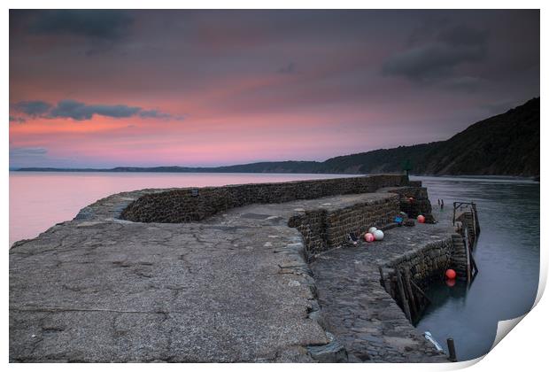 sunset at the harbour wall of Clovelly in Devon Print by Tony Twyman
