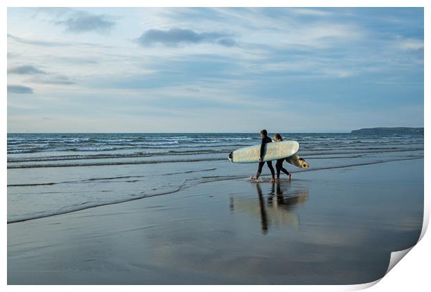 Surfer couple entering the sea at Westward Ho! Print by Tony Twyman